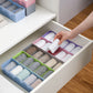 Clear plastic bead storage tray with multiple compartments for easy organization.